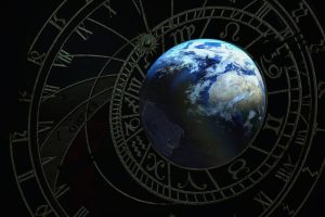 Obrazek przedstawia Ziemię na tle mapy astrologicznej