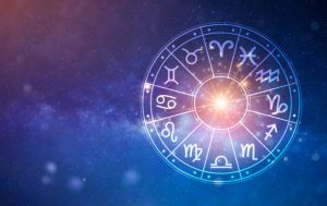 Zegar astrologiczny na tle galaktyki